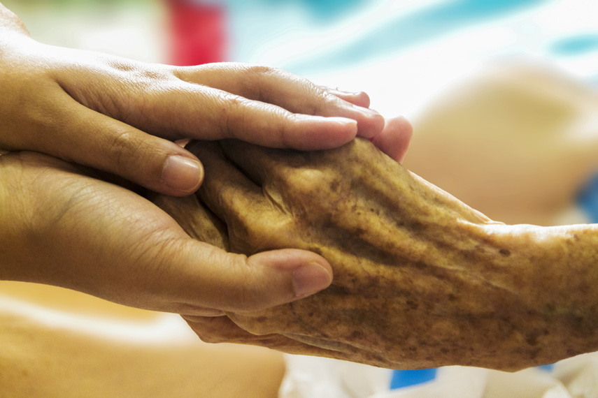 Holding an Elderly Hand with Care